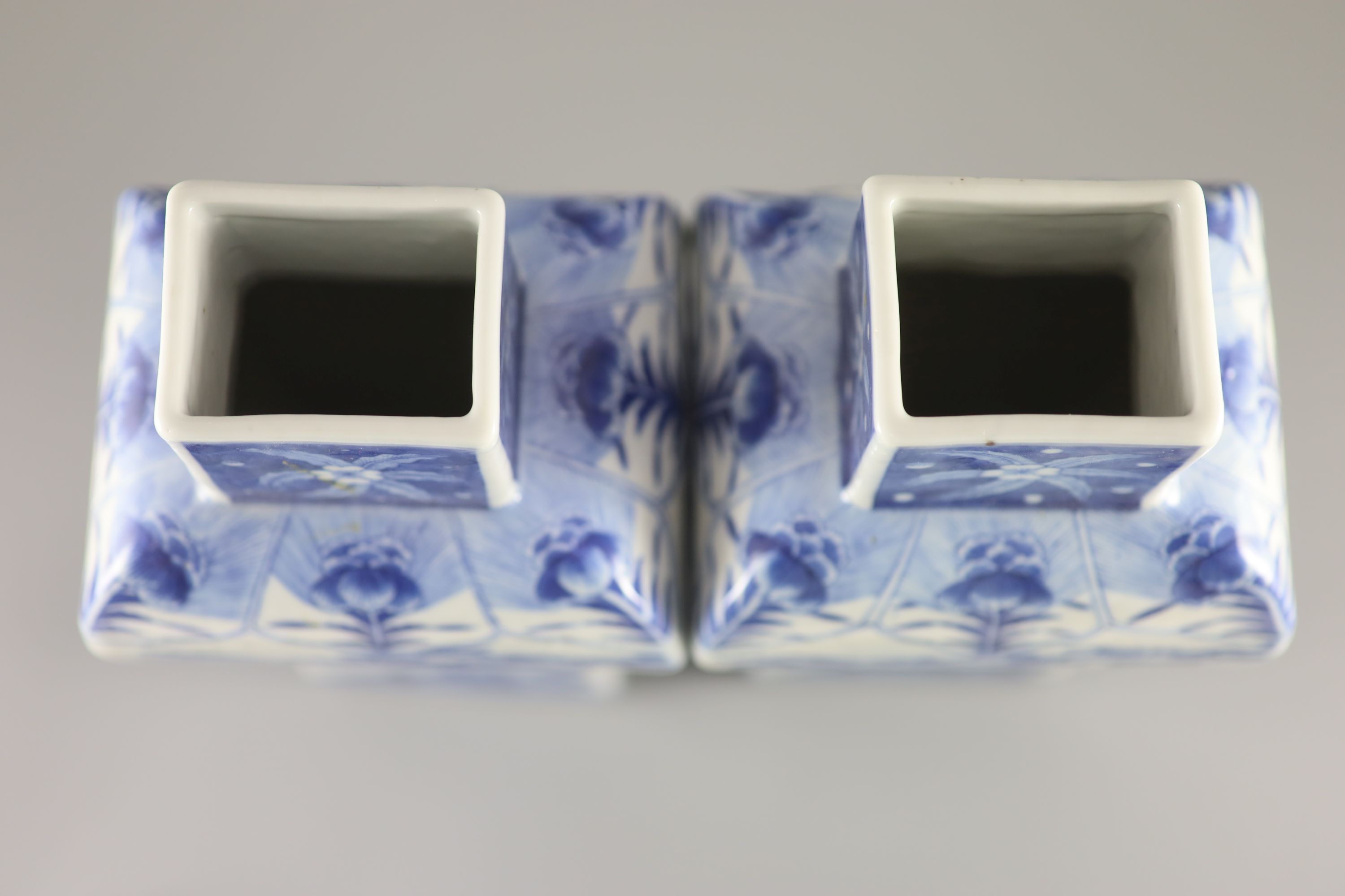 A pair of Chinese blue and white rectangular baluster vases and covers, Kangxi marks but 19th century, 36.5 cm